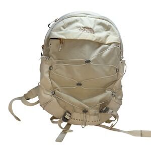 cream and rose gold north face backpack The Borealis for Women while side bungee cords allow for compression Rose Gold North Face Backpack